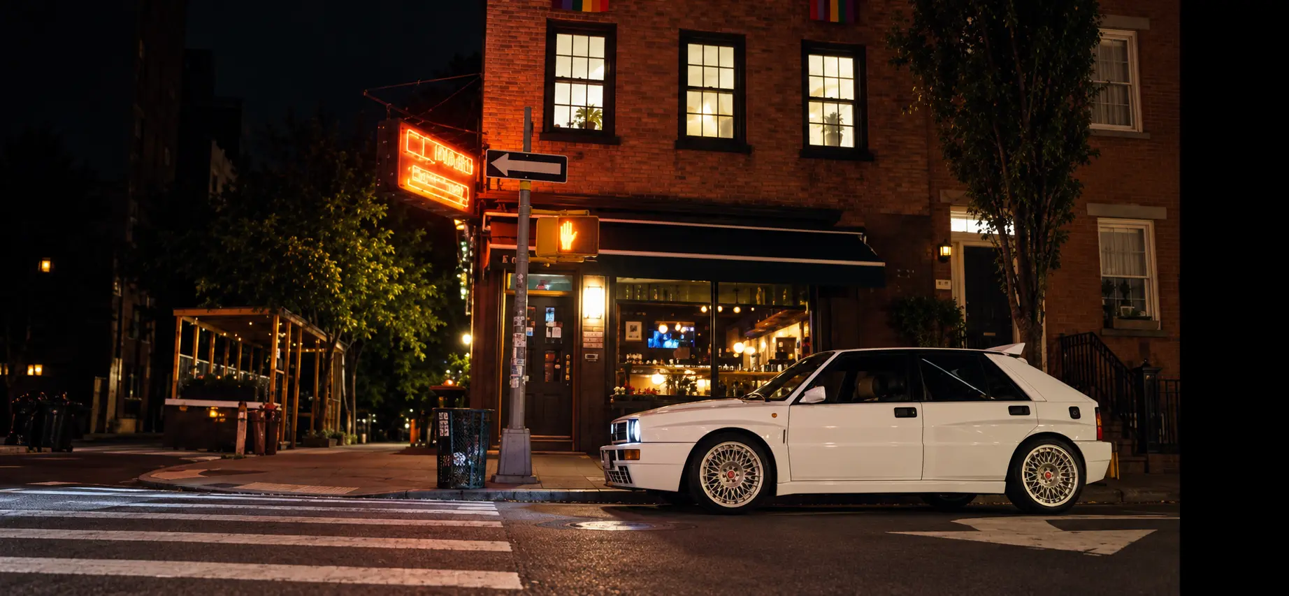 White performance car outside a private New York venue at night